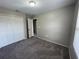 Bedroom features carpeting, closet and a window for natural light at 2520 Edgewater Falls Dr, Brandon, FL 33511