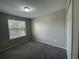 Bedroom features carpeting, closet and a window for natural light at 2520 Edgewater Falls Dr, Brandon, FL 33511