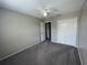 Neutral bedroom with carpeting, a ceiling fan, and a closet for storage at 2520 Edgewater Falls Dr, Brandon, FL 33511