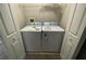 Laundry closet includes a side-by-side washer and dryer and a shelf for storage at 2520 Edgewater Falls Dr, Brandon, FL 33511