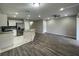 Bright and airy living room with modern flooring, stainless appliances, and ceiling fan at 2520 Edgewater Falls Dr, Brandon, FL 33511