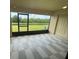 Relaxing screened patio overlooking a well-maintained yard and lush green space at 2520 Edgewater Falls Dr, Brandon, FL 33511