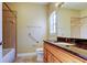 Neutral bathroom featuring light wood cabinets and a granite countertop at 263 Alexander Woods Dr, Plant City, FL 33563