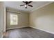 Large bedroom features wood floors, a ceiling fan, and a window at 263 Alexander Woods Dr, Plant City, FL 33563