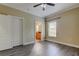 Bedroom featuring wood floors, and view to the bathroom at 263 Alexander Woods Dr, Plant City, FL 33563