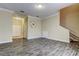 Open-concept living area boasting sleek tile flooring, neutral walls, and a staircase leading to the upper level at 263 Alexander Woods Dr, Plant City, FL 33563