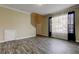 Open living area with tile flooring, stairs, storage closet, and a window with sheer curtains for ample natural light at 263 Alexander Woods Dr, Plant City, FL 33563