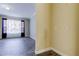 Light-filled living area featuring stylish tile flooring, neutral paint, and large window with sheer and black-out curtains at 263 Alexander Woods Dr, Plant City, FL 33563