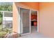 View from patio to the kitchen inside with sliding glass door access at 263 Alexander Woods Dr, Plant City, FL 33563