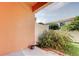 Cozy patio area with adjacent lawn and garden space at 263 Alexander Woods Dr, Plant City, FL 33563