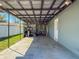 Back patio with utility shelving and a view of the backyard at 2869 36Th N Ave, St Petersburg, FL 33713