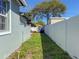 View of the backyard with a shed and white fence providing privacy at 2869 36Th N Ave, St Petersburg, FL 33713