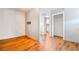 Open bedroom area with hardwood floors and open doorway at 2869 36Th N Ave, St Petersburg, FL 33713