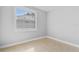 Bright bedroom with neutral walls, tile flooring, and a large window providing plenty of natural light at 2869 36Th N Ave, St Petersburg, FL 33713