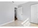 Spacious bedroom with neutral walls, tile flooring, and a large closet at 2869 36Th N Ave, St Petersburg, FL 33713