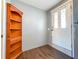Entryway with a traditional bookshelf and a white front door at 2869 36Th N Ave, St Petersburg, FL 33713
