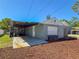 Detached garage with a connected carport on the back of the property at 2869 36Th N Ave, St Petersburg, FL 33713
