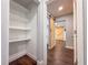 Hallway with wood floors leads to a room with a custom herringbone accent wall at 2869 36Th N Ave, St Petersburg, FL 33713