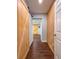 Hallway with wood floors featuring a wood accent wall and sliding barn door at 2869 36Th N Ave, St Petersburg, FL 33713