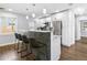 Stylish kitchen with white cabinets, stainless steel appliances, and a chic backsplash on the kitchen island at 2869 36Th N Ave, St Petersburg, FL 33713