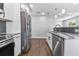 Bright kitchen featuring stainless steel appliances, marble countertops, and a tiled backsplash at 2869 36Th N Ave, St Petersburg, FL 33713