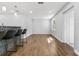 Open-concept living room featuring new floors, modern lighting, and a kitchen island with bar seating at 2869 36Th N Ave, St Petersburg, FL 33713