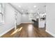 Open-concept living room featuring new floors, modern lighting, and a kitchen island with bar seating at 2869 36Th N Ave, St Petersburg, FL 33713