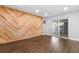 Living space featuring a wood accent wall and sliding glass doors at 2869 36Th N Ave, St Petersburg, FL 33713