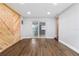 Spacious living area featuring wood accent wall and sliding glass doors at 2869 36Th N Ave, St Petersburg, FL 33713
