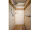 Detailed view of the tiled shower with handrails and showerhead at 2869 36Th N Ave, St Petersburg, FL 33713