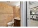 Charming half-bathroom with tan tile and a decorative vanity with a vintage-style mirror at 2970 68Th S Ave, St Petersburg, FL 33712