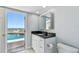 Bathroom with water view and access to outdoor patio at 2970 68Th S Ave, St Petersburg, FL 33712