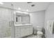 Modern bathroom with a glass-enclosed shower and white vanity at 2970 68Th S Ave, St Petersburg, FL 33712