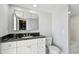 Bathroom featuring black marble countertop and decorative hardware at 2970 68Th S Ave, St Petersburg, FL 33712