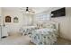 Comfortable bedroom features twin beds with ocean-themed bedding, ceiling fan, and TV at 2970 68Th S Ave, St Petersburg, FL 33712