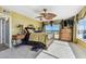 Bedroom with waterfront view, detailed window coverings, and walkout balcony access at 2970 68Th S Ave, St Petersburg, FL 33712
