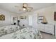 Bright bedroom with two twin beds, ceiling fan, and nautical decor at 2970 68Th S Ave, St Petersburg, FL 33712