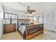 Charming bedroom with wood furniture, tropical ceiling fan, and tile flooring at 2970 68Th S Ave, St Petersburg, FL 33712