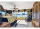 Spacious bedroom features a waterfront view, sitting chair, and walk out access at 2970 68Th S Ave, St Petersburg, FL 33712