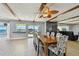 Spacious dining area boasts wood beams, a stylish table, and scenic water views at 2970 68Th S Ave, St Petersburg, FL 33712