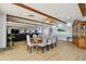 Open-concept dining area with wood beams, modern furniture and water views at 2970 68Th S Ave, St Petersburg, FL 33712