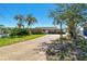 A charming home featuring a stone facade, spacious driveway, and well-maintained landscaping at 2970 68Th S Ave, St Petersburg, FL 33712