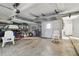 Spacious garage with lots of storage space, featuring a large door and shelving units at 2970 68Th S Ave, St Petersburg, FL 33712
