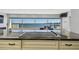Kitchen island with a cooktop and views of the ocean at 2970 68Th S Ave, St Petersburg, FL 33712