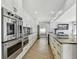 Modern kitchen featuring stainless steel appliances and granite countertops at 2970 68Th S Ave, St Petersburg, FL 33712