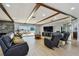 Spacious living room boasts wood beam ceilings, tile floors, and water views at 2970 68Th S Ave, St Petersburg, FL 33712
