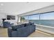 Bright living room features a large window with water views and comfortable, modern seating at 2970 68Th S Ave, St Petersburg, FL 33712