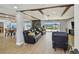 Spacious living room boasts wood beam ceilings, tile floors, and water views at 2970 68Th S Ave, St Petersburg, FL 33712