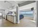 Bright living room with water views, modern furniture, and recessed lighting at 2970 68Th S Ave, St Petersburg, FL 33712