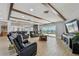 Spacious living room boasts wood beam ceilings, tile floors, and access to outdoor space at 2970 68Th S Ave, St Petersburg, FL 33712